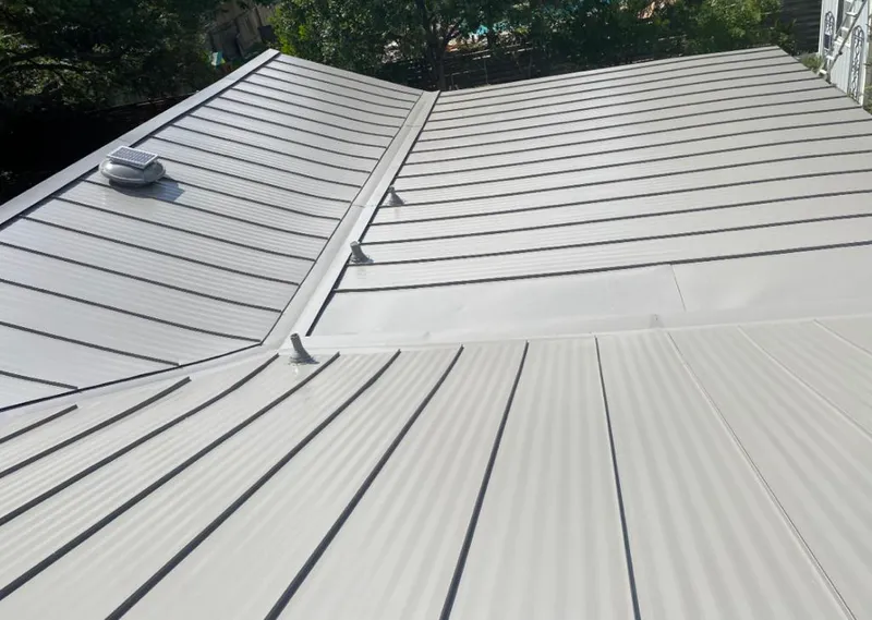 Solar attic fan installed on a metal roof for Roof Ventilation in Perkasie